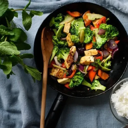 spicy tofu and broccoli dish in skillet